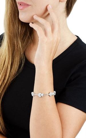 Pave CZ Heart Bracelet - thegreatputonmvPave CZ Heart BraceletPave CZ Heart BraceletPave CZ Heart BraceletBraceletKing BabythegreatputonmvQ42 - 9166 - 7.5Pave white CZ .925 sterling silver Hearts measure Height: 2/3'' Width: 1/3'' Depth: 1/4'' Handmade In USA61493383