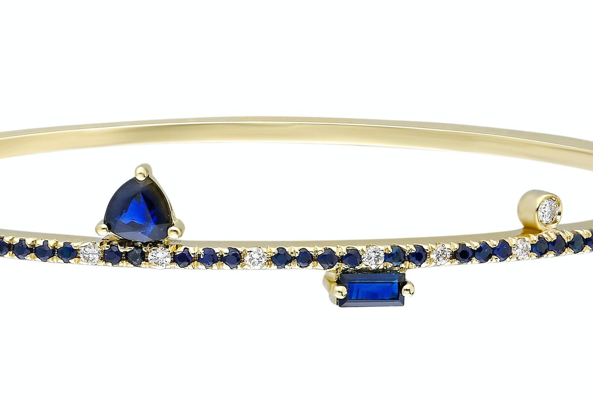Sapphire Bangle - thegreatputonmvSapphire BangleSapphire BangleSapphire BangleBraceletHarikathegreatputonmvHB51Blue sapphire and 14k yellow gold bangle with double clasp Blue sapphire: .57CT White diamonds: .16CT Blue sapphire trillion: .42CT Blue sapphire baguette: .16CT Made in Turkey78535815