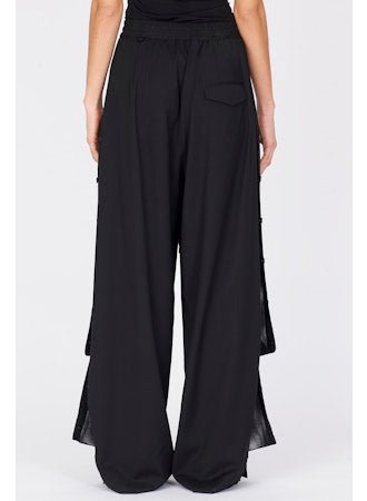 Wide - leg Wool Trousers - thegreatputonmvWide - leg Wool TrousersWide - leg Wool TrousersWide - leg Wool TrousersISABEL BENENATOthegreatputonmvDW35F25Wide - leg Wool Trousers40Black