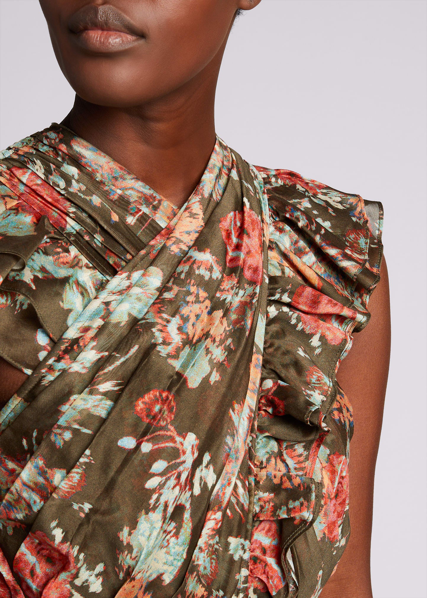 Featured in look 17 from our Spring 2021 runway presentation. The Sarafina Dress is crafted from our lightweight yet structured cotton silk organza fabrication in an unexpected dark olive and deep rose bouquet floral print. This sexy mini dress silhouette is adorned in feminine details including a pleated criss-cross neckline, layered ruffled skirt, and flutter sleeves. Side zipper closure. Composition: 79% Cotton, 21% Silk.