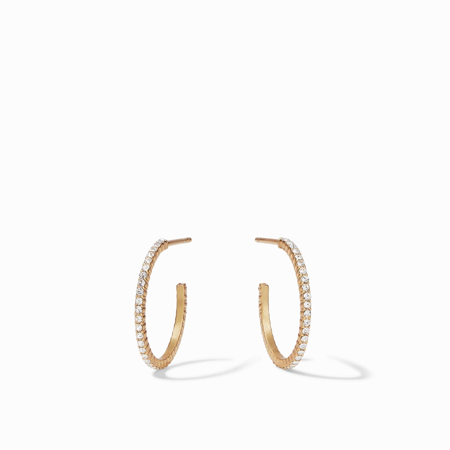 Sparkle and shine in a pair of striking CZ hoop earrings adorned with pavé CZ. These slender, thin hoops are available in four different sizes.