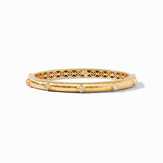 Noel Stone Bangle - thegreatputonmvNoel Stone BangleNoel Stone BangleNoel Stone BangleBraceletJulie VosthegreatputonmvBG273GCZTen diamond - shaped brilliant cut CZ gemstones embellish this lightly hammered bangle with a delicate piercework interior.GoldMedium47421575