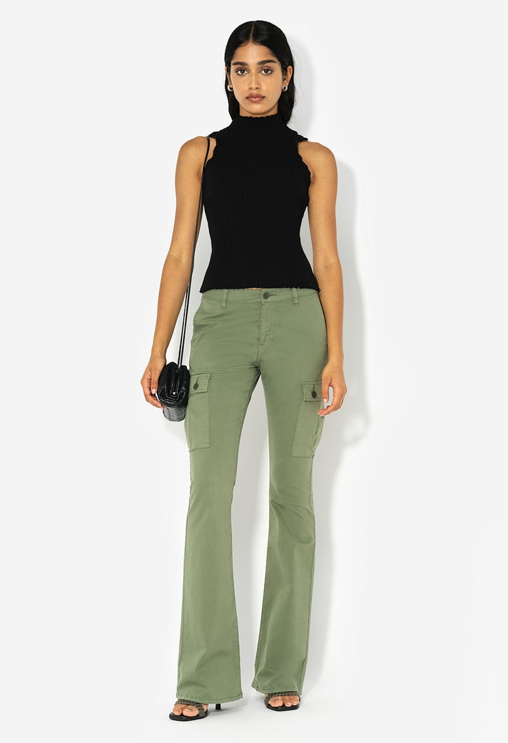 Sleeveless mock neck top in stretch knit rib. Garment dyed. Made in Los Angeles.  100% Cotton.  Fits true to size, take your normal size. Model is 5'9" and wears a size 1 / Small.  Machine wash cold, hang to dry.