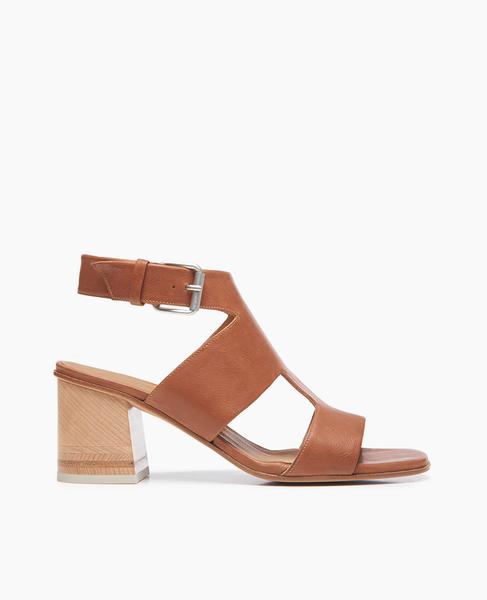A substantial and secure t-strap offers the Berry sandal a modern streamlined look atop our newest tonal wood-inlay heel. In a soft, vegetable-tanned cuoio leather. Large buckle closure.  