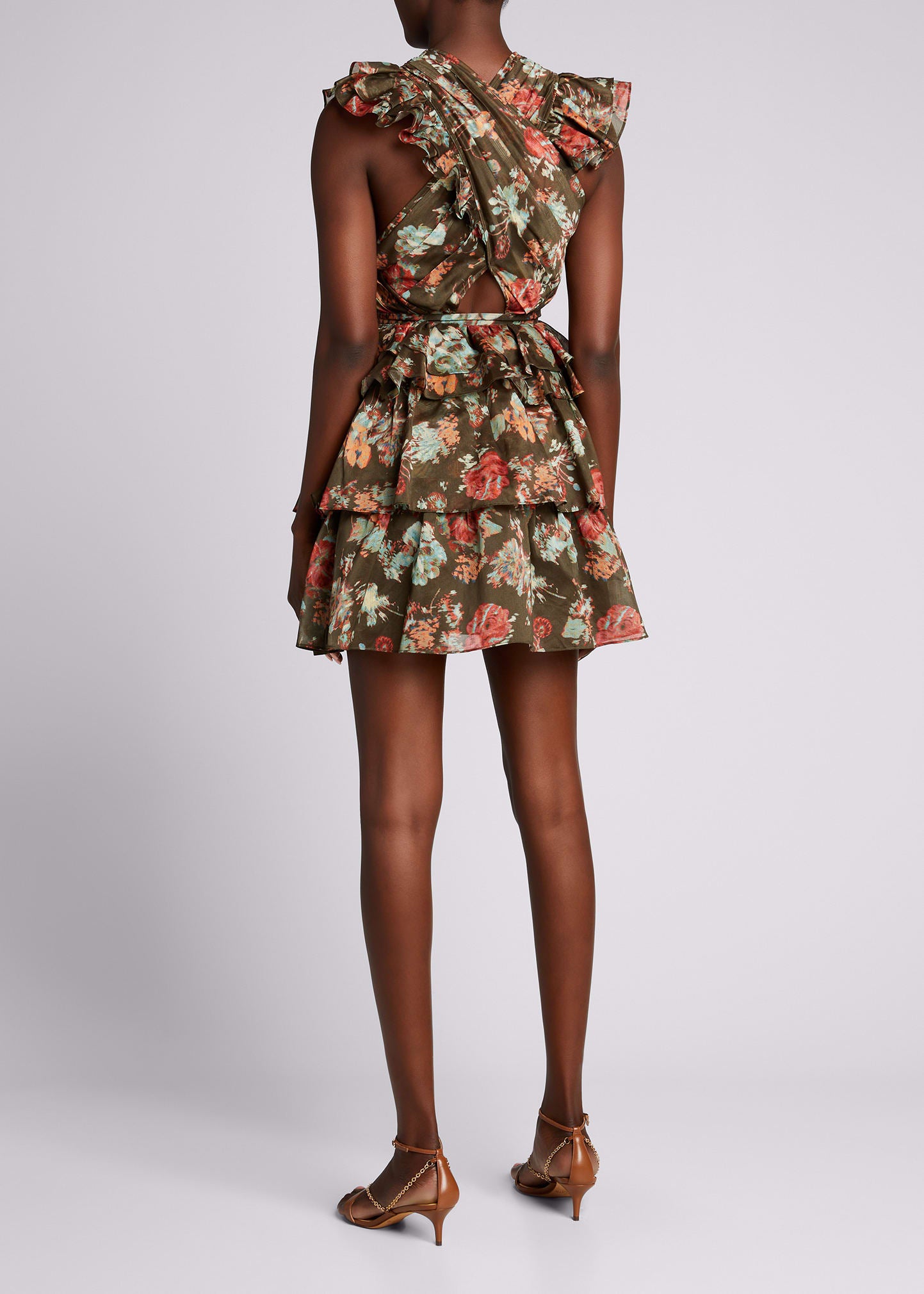 Featured in look 17 from our Spring 2021 runway presentation. The Sarafina Dress is crafted from our lightweight yet structured cotton silk organza fabrication in an unexpected dark olive and deep rose bouquet floral print. This sexy mini dress silhouette is adorned in feminine details including a pleated criss-cross neckline, layered ruffled skirt, and flutter sleeves. Side zipper closure. Composition: 79% Cotton, 21% Silk.